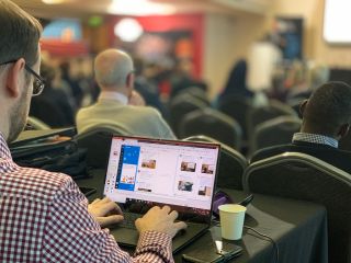image of man writing on laptop